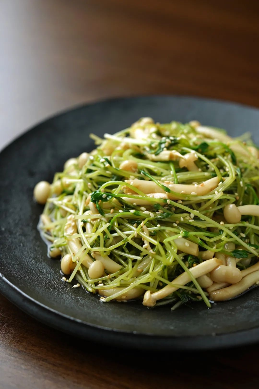 Plated salad with mushrooms and pea shoots