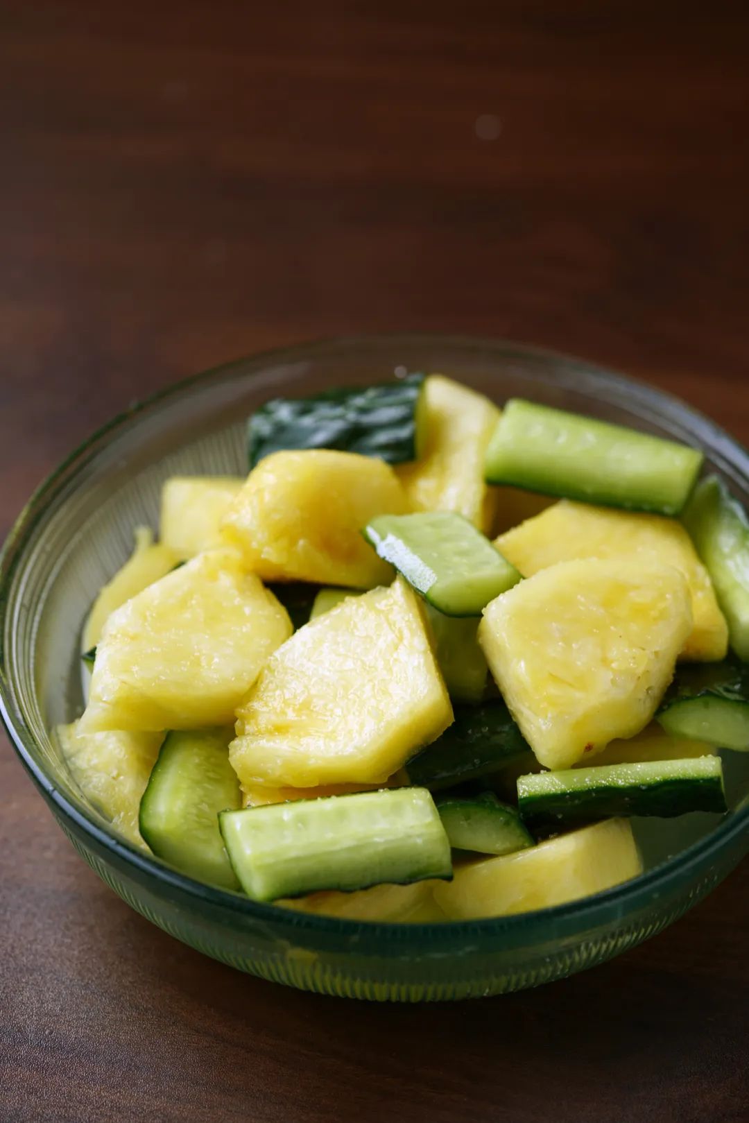 Colorful pickled fruits and vegetables arranged in a bowl