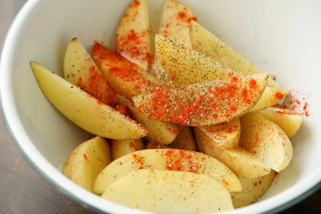 Golden crispy potato wedges with herb seasoning