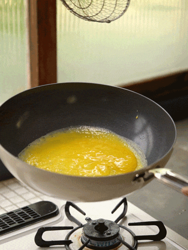 Animated GIF of chef tossing ingredients in wok