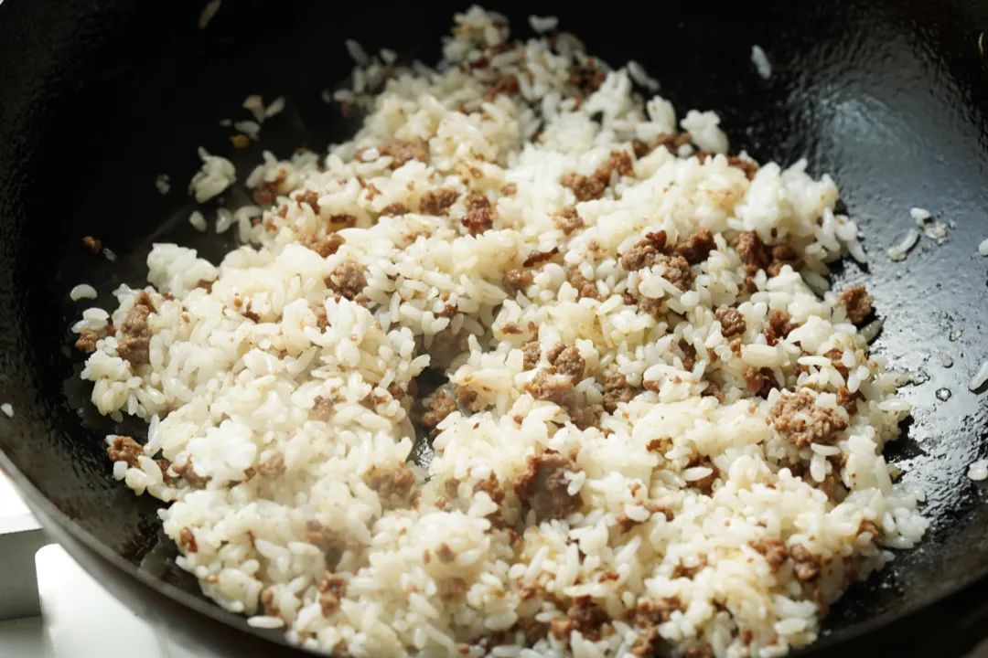 Reheated fried rice in a skillet
